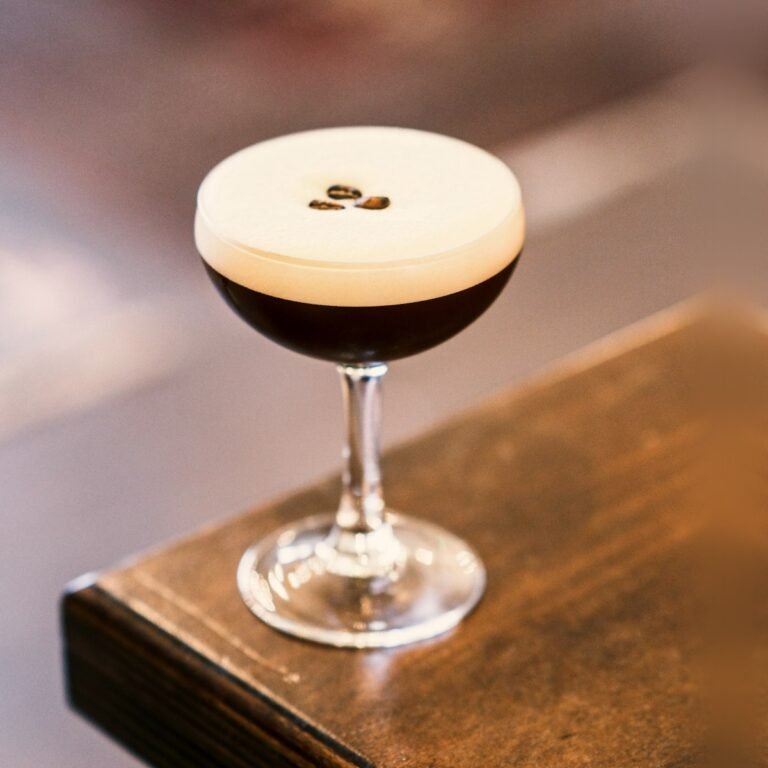 An Espresso Martini with three coffee beans