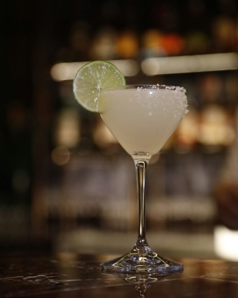 A Margarita with a salt rim and lime